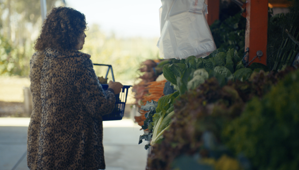 A customer shopping for fresh produce at Guytan Family Farms