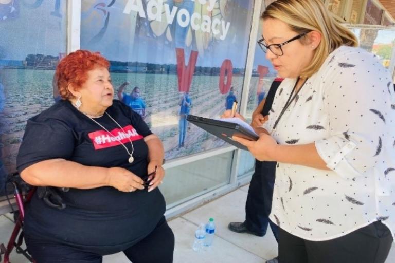 Marivel Castaneda assists a customer with an application