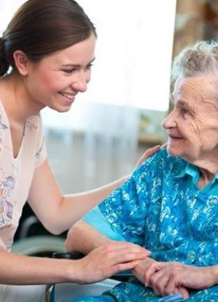 Caregiver assists client with in-home services.