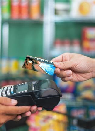 A customer pays with an EBT card for food